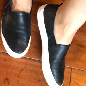 Black leather flat sneakers